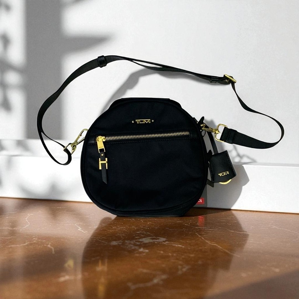 Tumi ✨Black and Gold Crossbody Bag ✨Sleek Design